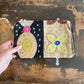 Colourful patchwork purse on a wooden surface