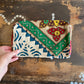 Colourful patchwork purse on a wooden surface