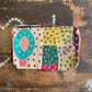 Colourful patchwork purse on a wooden surface