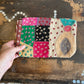 Colourful patchwork purse on a wooden surface