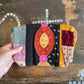 Handmade colourful patchwork purse on a wooden surface